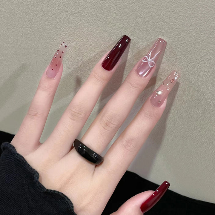 Artistic Long Press-On Nails Set with Glossy and Decorative Accents Stornfield