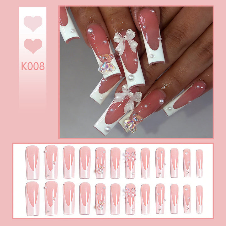 Elegant artificial nails with delicate bows and pearls Stornfield
