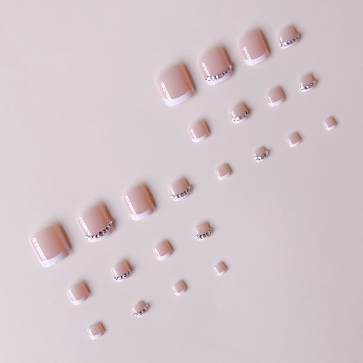 Nail art set with elegant French design and sparkling accents Stornfield