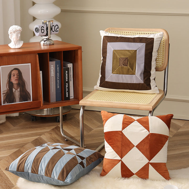 Square decorative cushion with striped velvet inlay and geometric pleated look