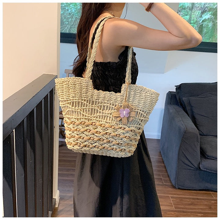 Handwoven beach bag with floral accents Stornfield