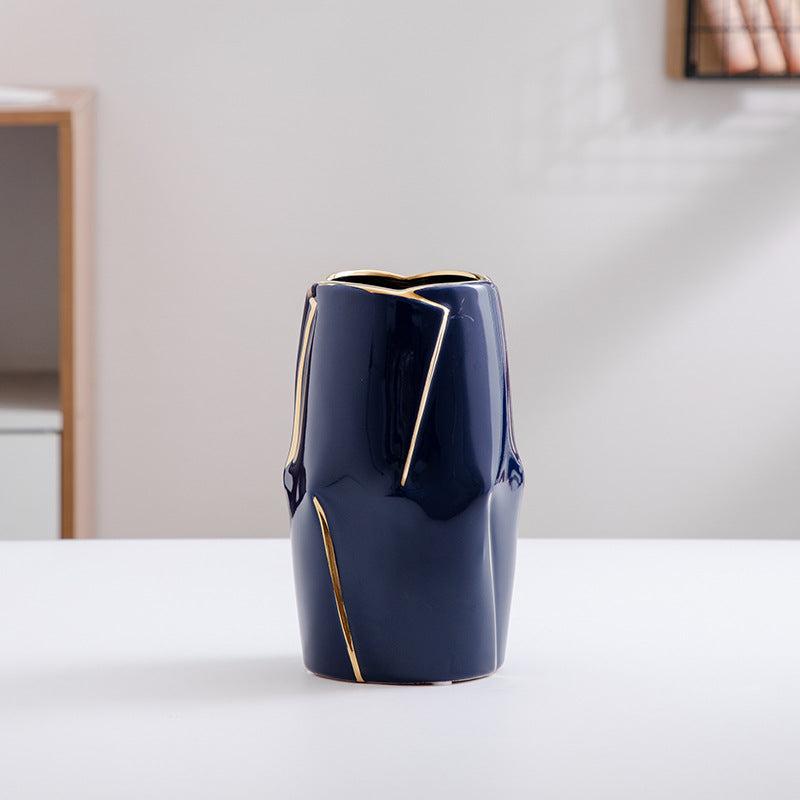 Decorative ceramic vase with golden accents Stornfield