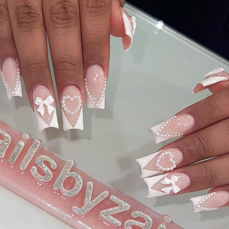 Artificial nail set with filigree hearts and bow decorations Stornfield
