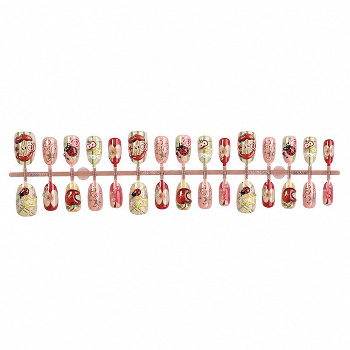 Creative nail art set with playful designs and glitter accents Stornfield