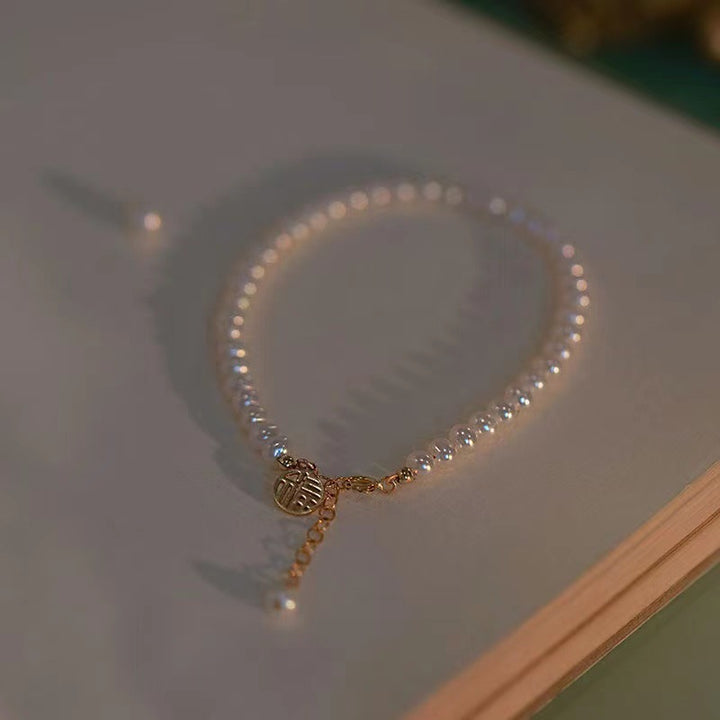 Elegant Pearl Charm Bracelet Stornfield