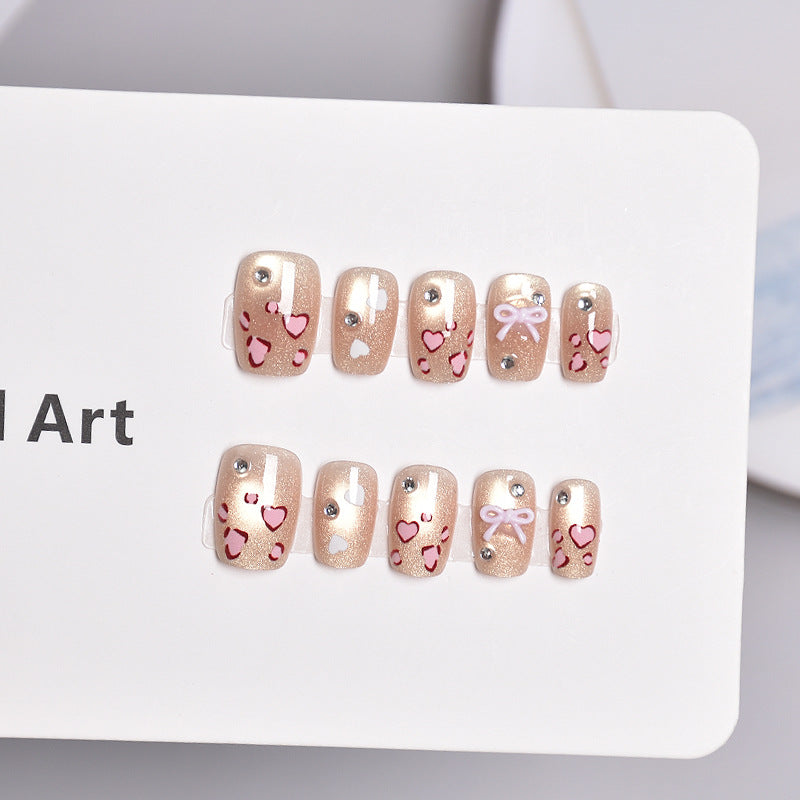 Artistic Press-On Nail Set with Heart and Bow Designs Stornfield