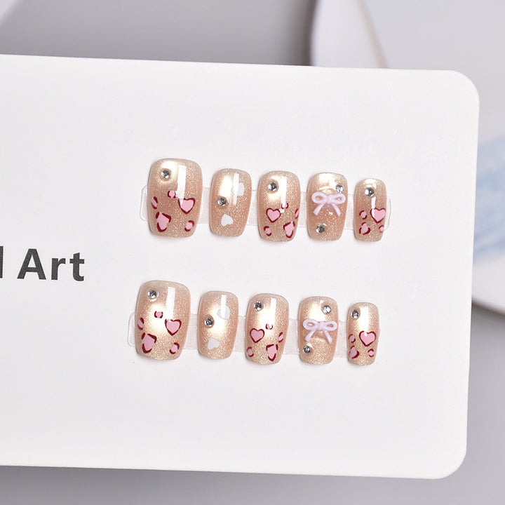Artistic Press-On Nail Set with Heart and Bow Designs Stornfield