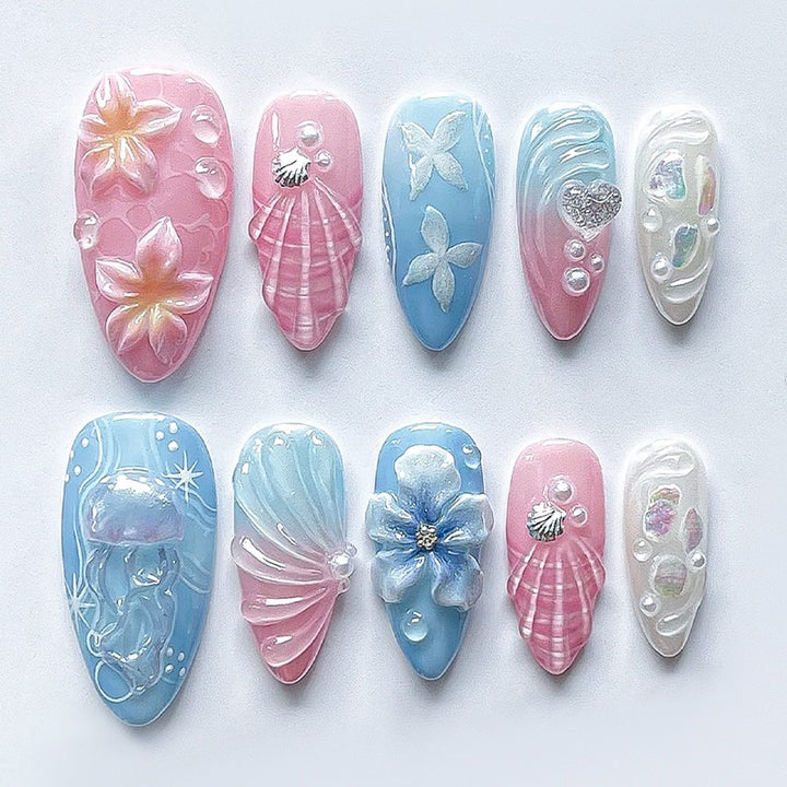 Artificial nail set with creative floral and glittering accents Stornfield