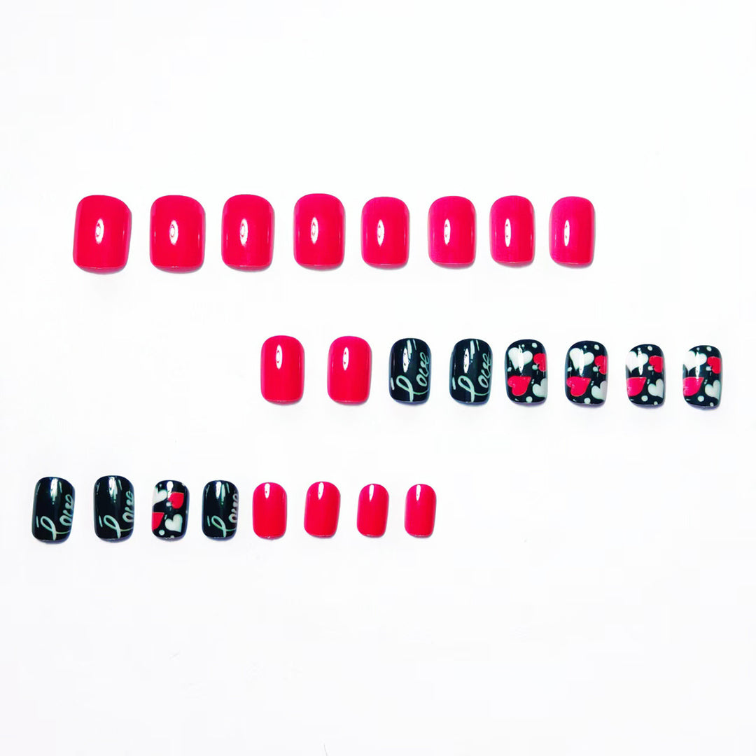 Acrylic nail design with hearts and kiss motifs Stornfield