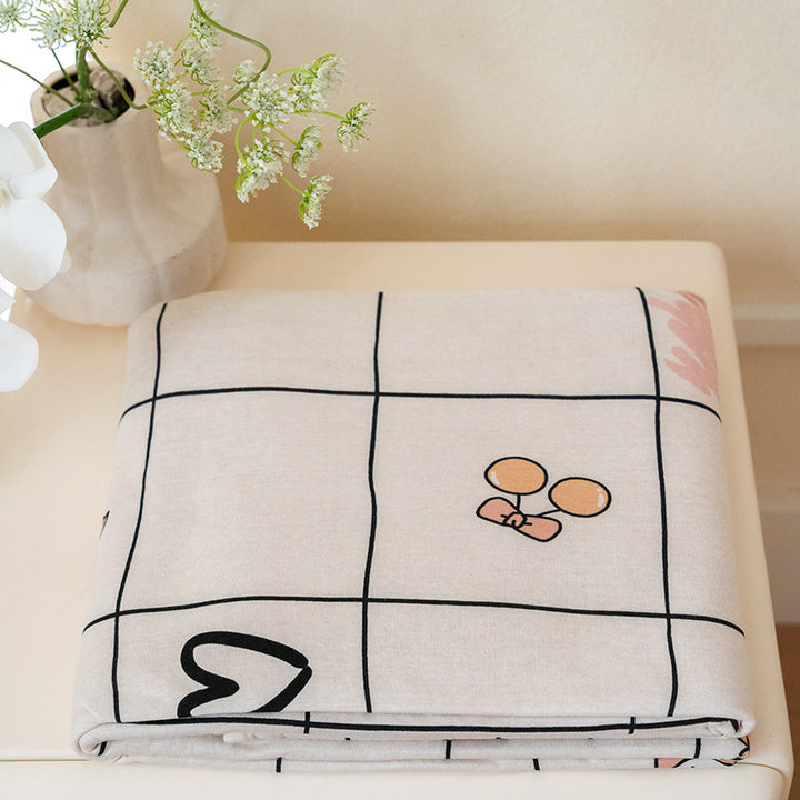 Organic Cotton Muslin Swaddle Blanket with Playful Cartoon Print