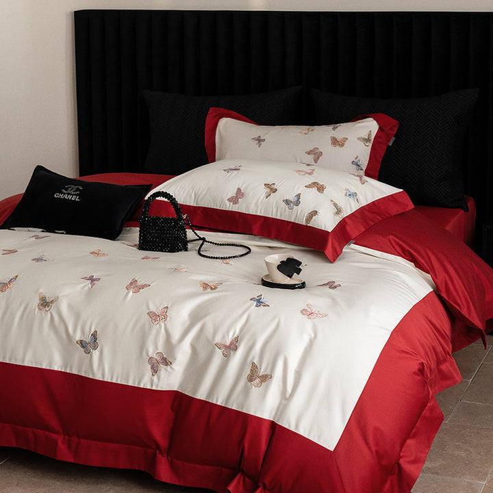 Luxurious cotton satin bedding set with embroidered butterfly appliqués
