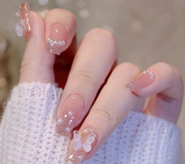 Elegant nail design with pearl embellishment Stornfield
