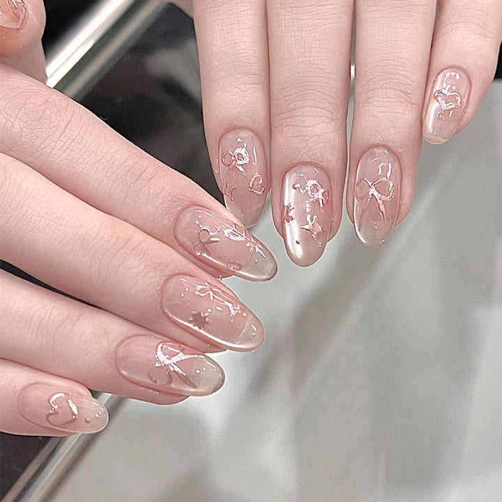 Elegant Artistic Press-On Nail Art with Bow & Heart Designs Stornfield