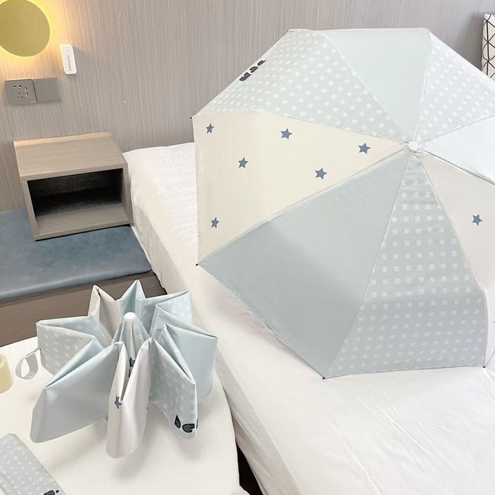 Women's folding umbrella with unique star pattern and practical carrying bag Stornfield