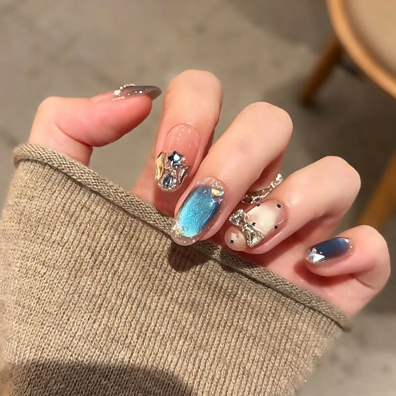 Art nails in elegant premium design with rhinestone and glitter elements Stornfield