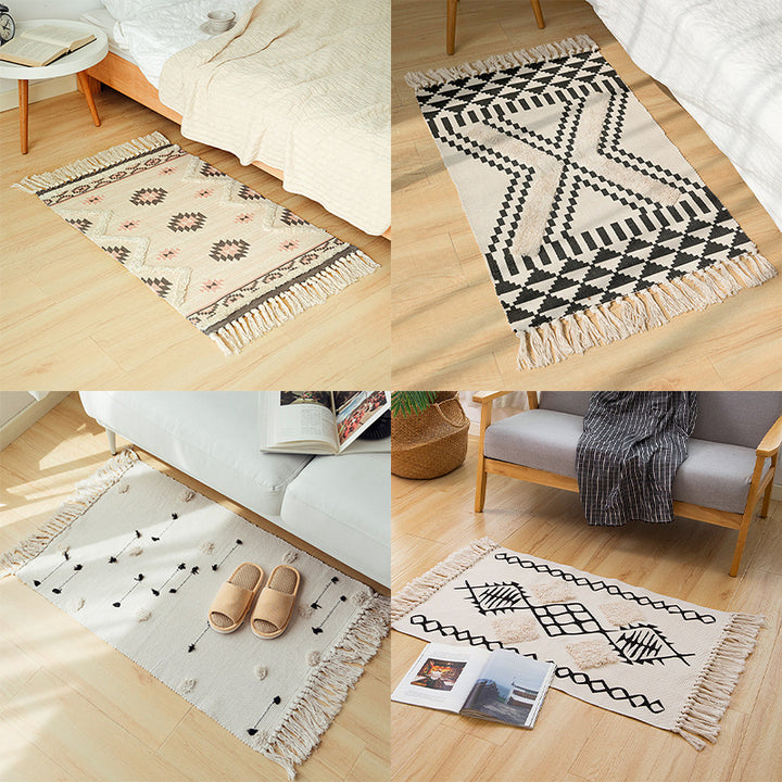 Hand-tufted bathroom mat with fringes, decorative dot-and-dash pattern and non-slip backing Stornfield