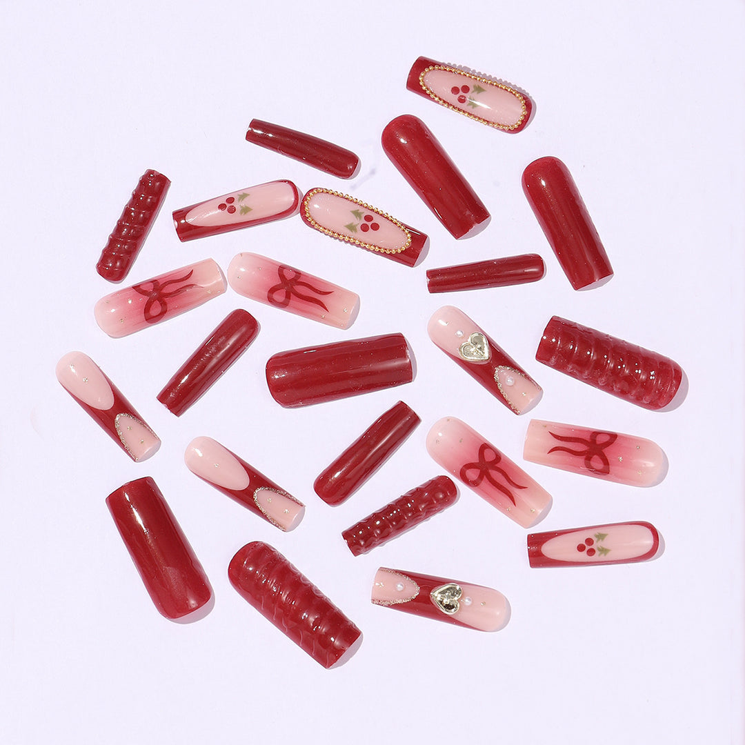 Artificial nail set with festive accents and glitter embellishments Stornfield