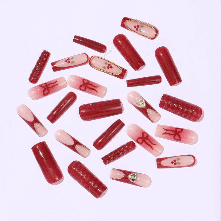 Artificial nail set with festive accents and glitter embellishments Stornfield