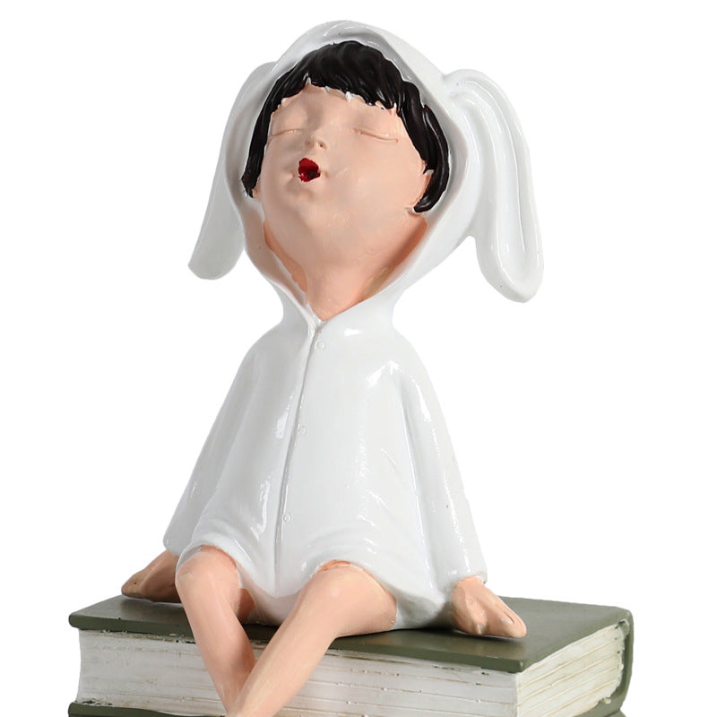 Playful Ceramic Book Figure
