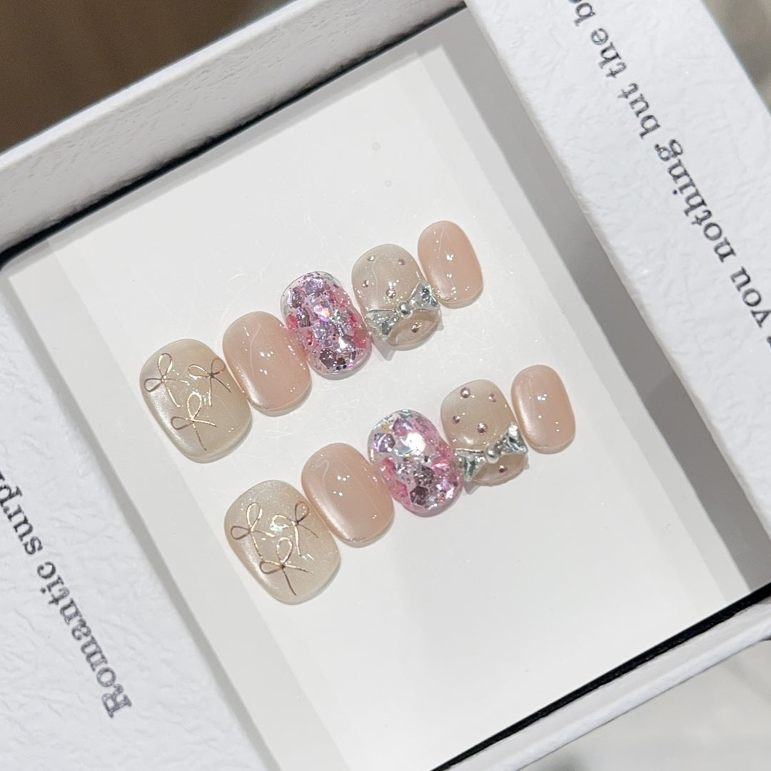 Artificial nails with romantic bow design Stornfield