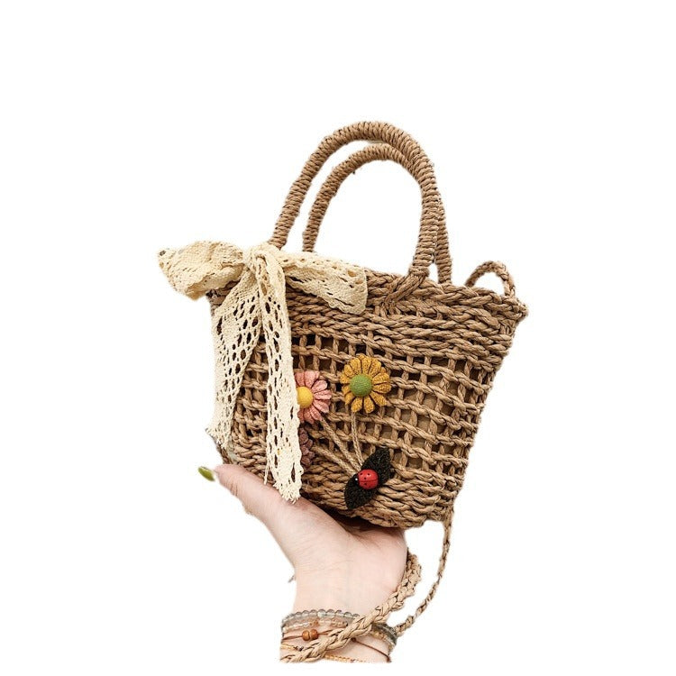 Playful basket bag with floral appliqués Stornfield