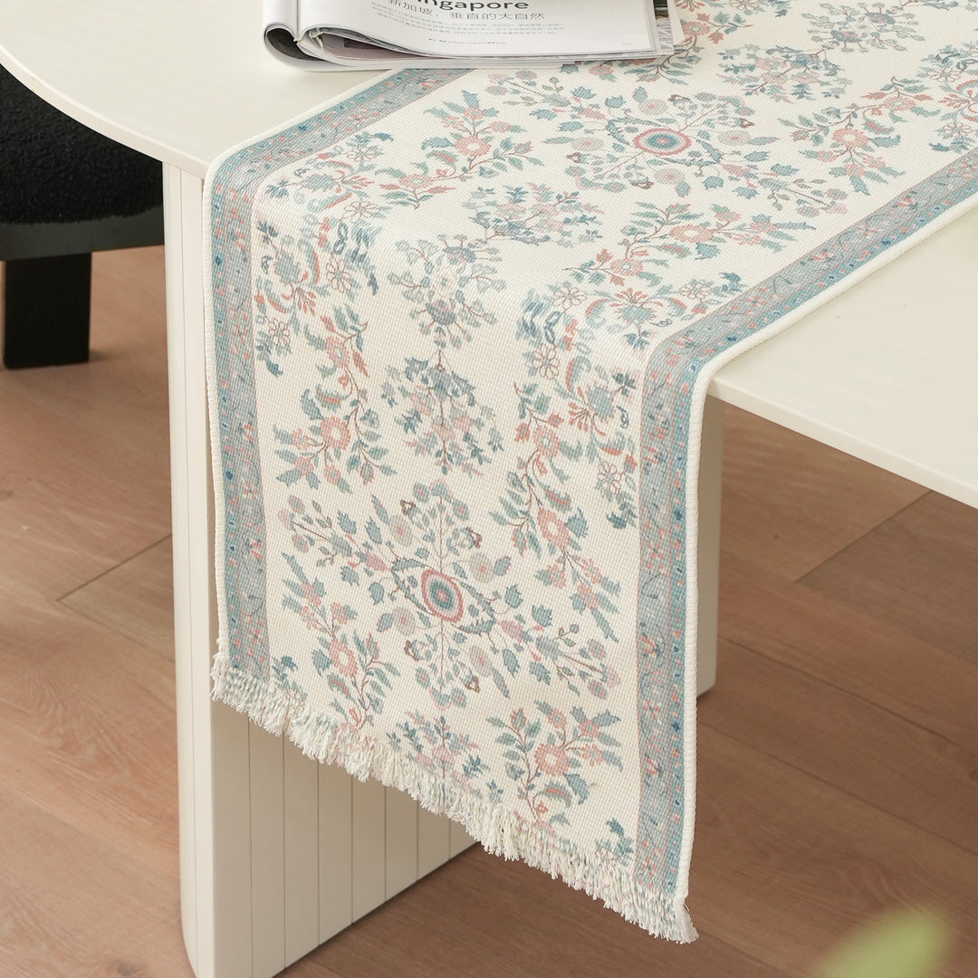 Woven jacquard table runner with floral medallion and fringes Stornfield