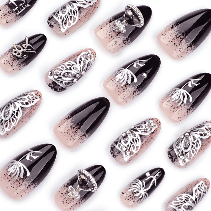 Artful stiletto nails with delicate embellishments and glamour accents Stornfield