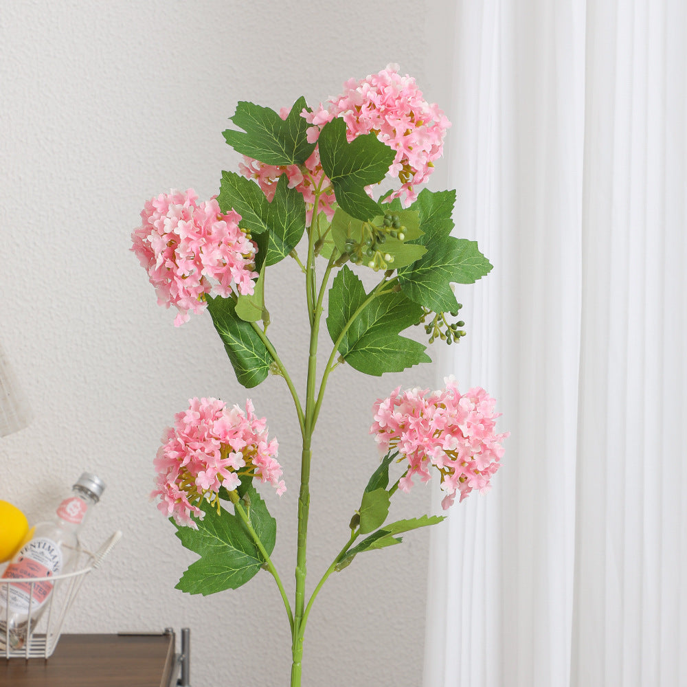 Artificial hydrangea branch with vibrant flowers and detailed leaves
