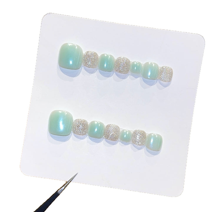 Acrylic nail set with glitter and pastel accent Stornfield