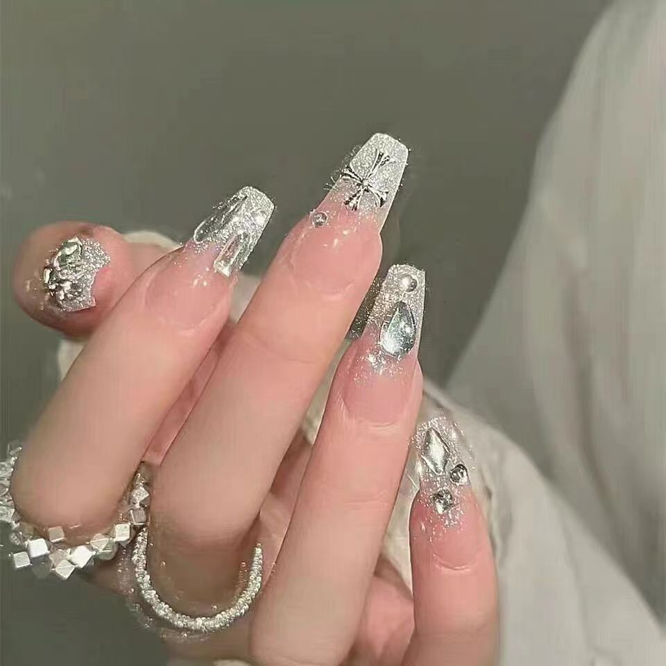 Artificial nails with heart accent and glamorous decorations Stornfield