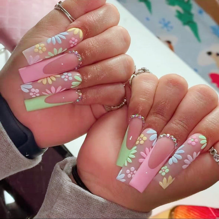 Artificial nail set with floral 3D embellishments and rhinestone accents Stornfield