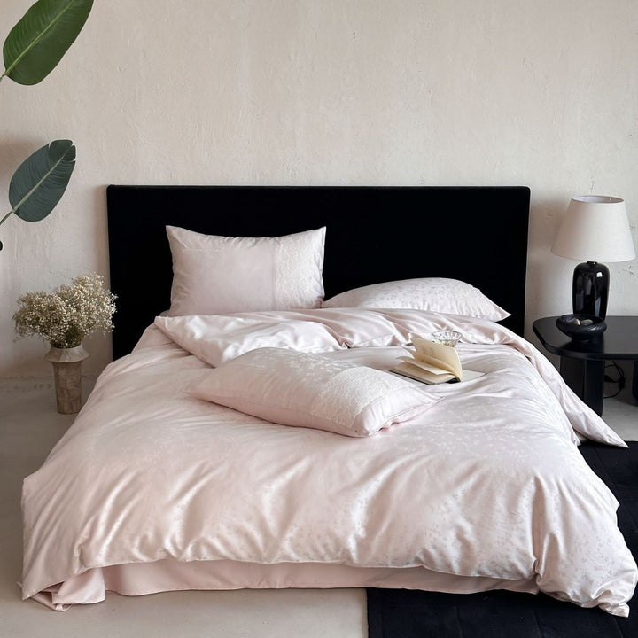 Satin bed set with subtle floral jacquard, reversible look and elegant piping seam