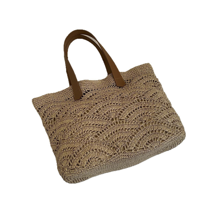 Handbag made of high-quality woven natural material with elegant leather handles Stornfield