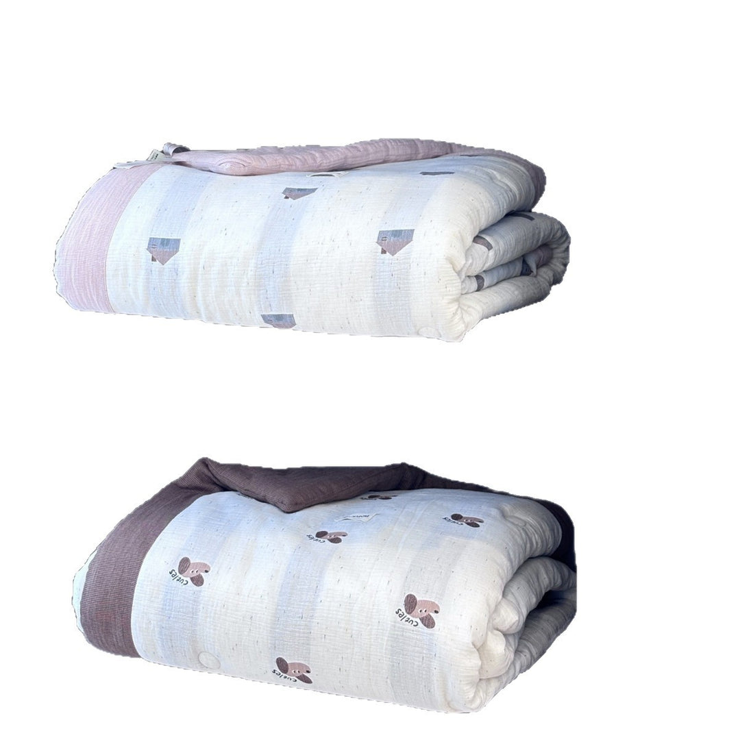 Quilted children's blanket with cute dog motif and muslin surface