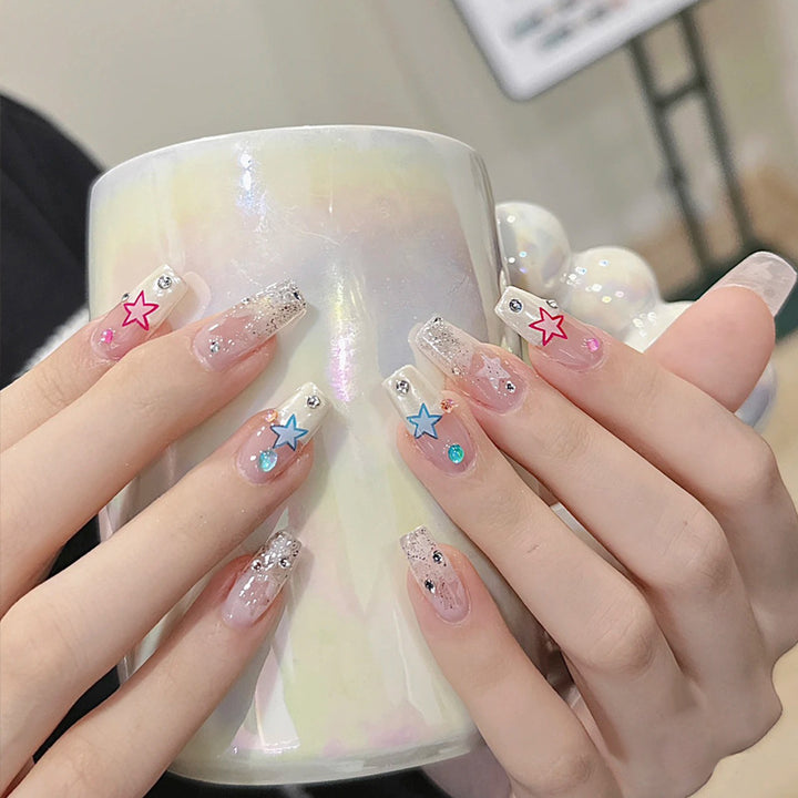 Artificial nails with heart design and glitter accents Stornfield