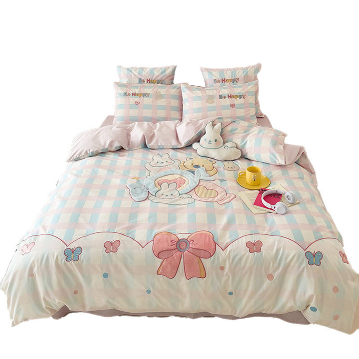 Playful cotton bedding set with embroidered bunny and cherry motif including decorative pillow