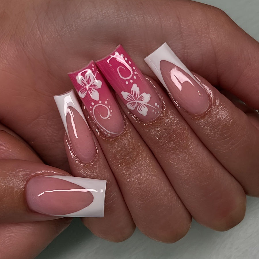 Artificial nails with floral accents and shine Stornfield