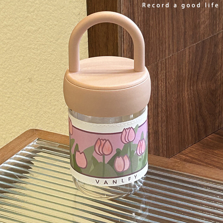 Women's insulated drinking bottle with ergonomic carrying handle and elegant flower design Stornfield