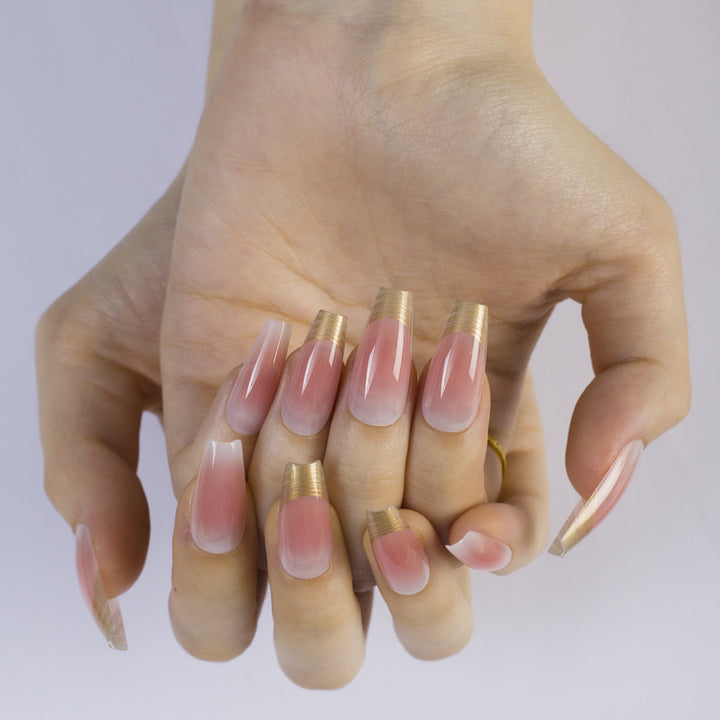 Shiny artificial nails with elegant gold rim Stornfield