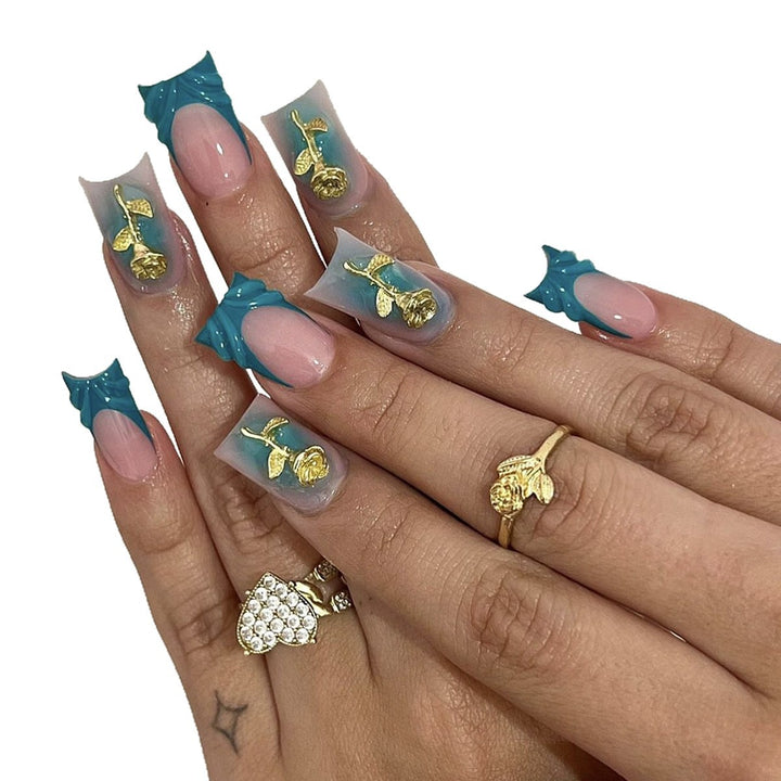 Elegant artificial nail creations with golden embellishments Stornfield