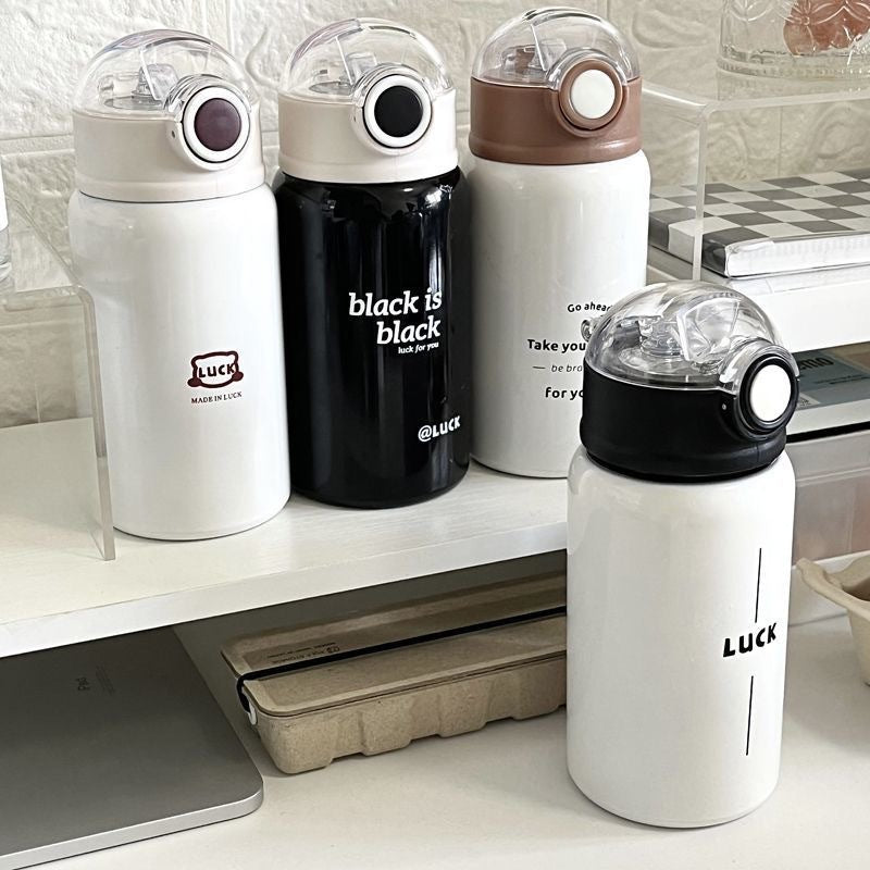 Women's insulated drinking bottle with innovative flip lid and practical handle Stornfield