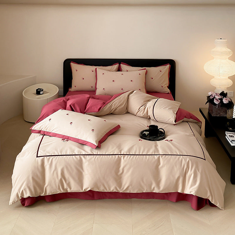 High-quality cotton satin bedding set with delicate embroidery, reversible feature & piping edge