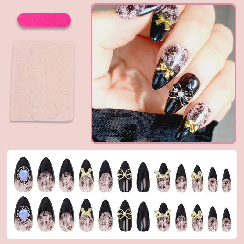 Artificial nail set with elegant dot and bow decorations Stornfield