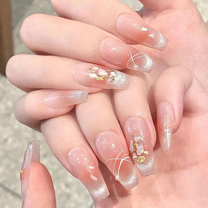 Artificial nail set with elegant glitter and flower decorations Stornfield