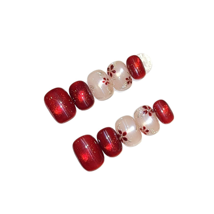 Artificial nails with elegant floral and glitter designs Stornfield
