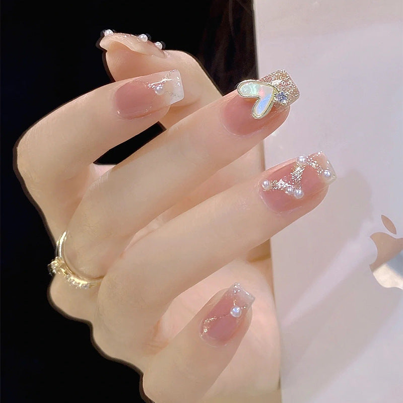 Artificial nail set with elegant pearl and glitter accents Stornfield