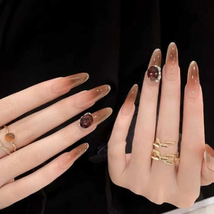Glittering artificial nails with elegant tip design and crystal decoration Stornfield