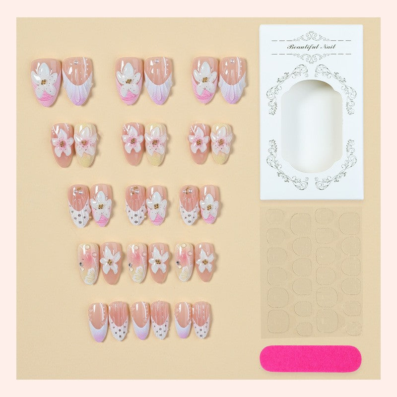 Nail art set with elegant floral design and glitter accents Stornfield
