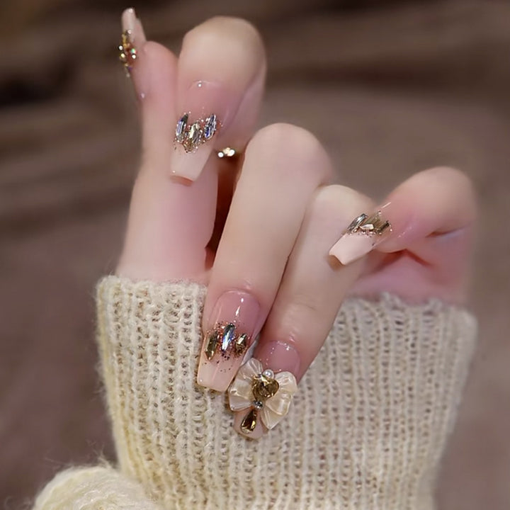 Artificial nails with heart accent and glamorous decorations Stornfield