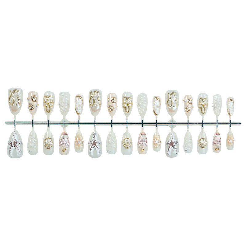 luxurious artificial nail set with maritime designs and golden accents Stornfield